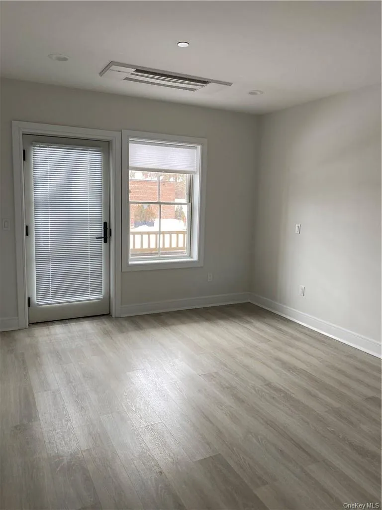 Living room with light wood-type flooring Living room with light wood-type flooring