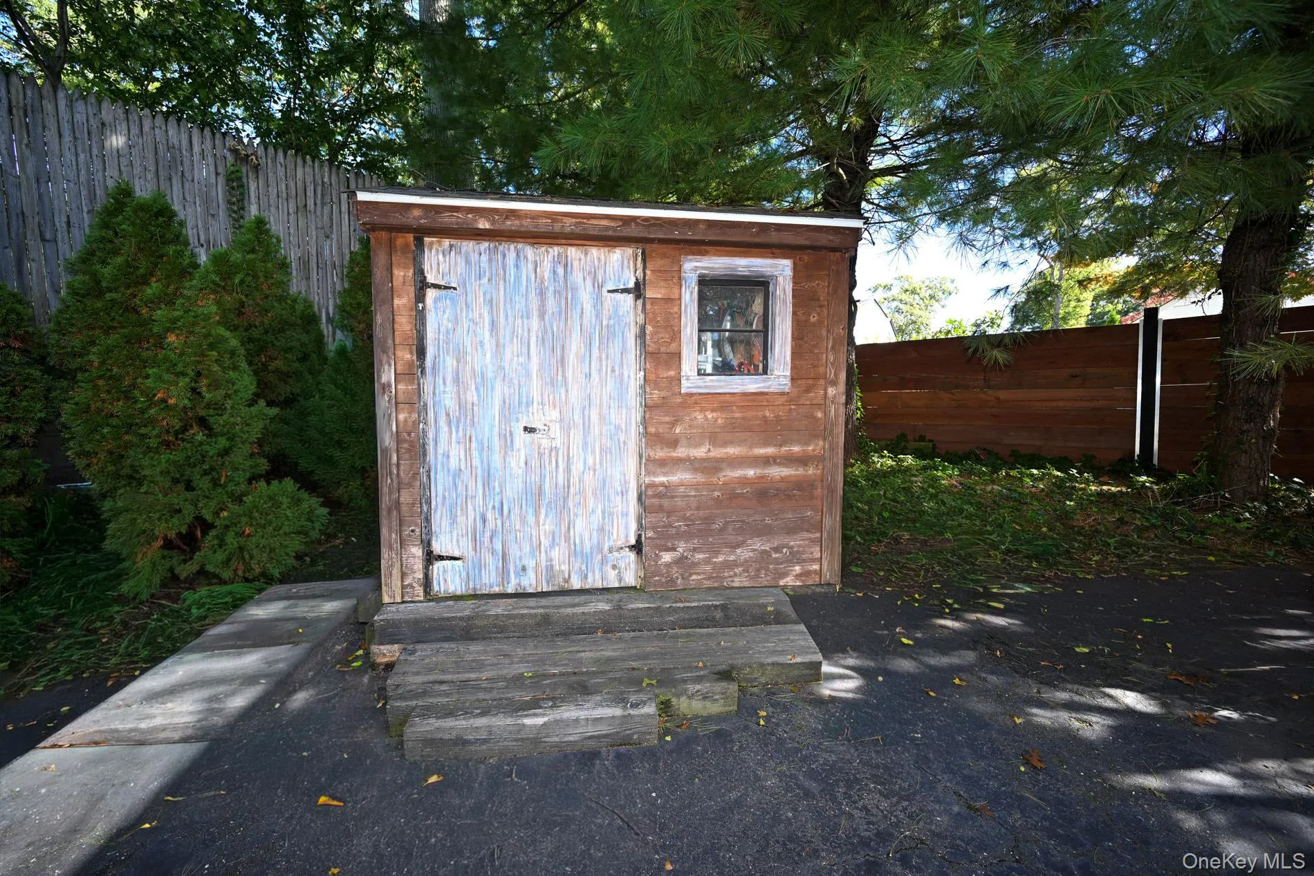 Shed on the Side of end of the Driveway Shed on the Side of end of the Driveway