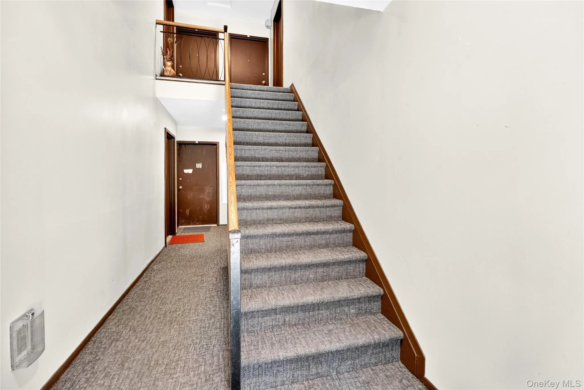 Interior stairway leading to the condominium, second floor. Interior stairway leading to the condominium, second floor.