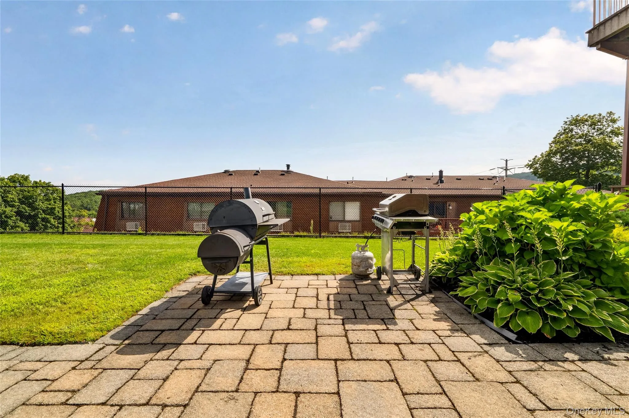 Community outdoor grilling area. Community outdoor grilling area.