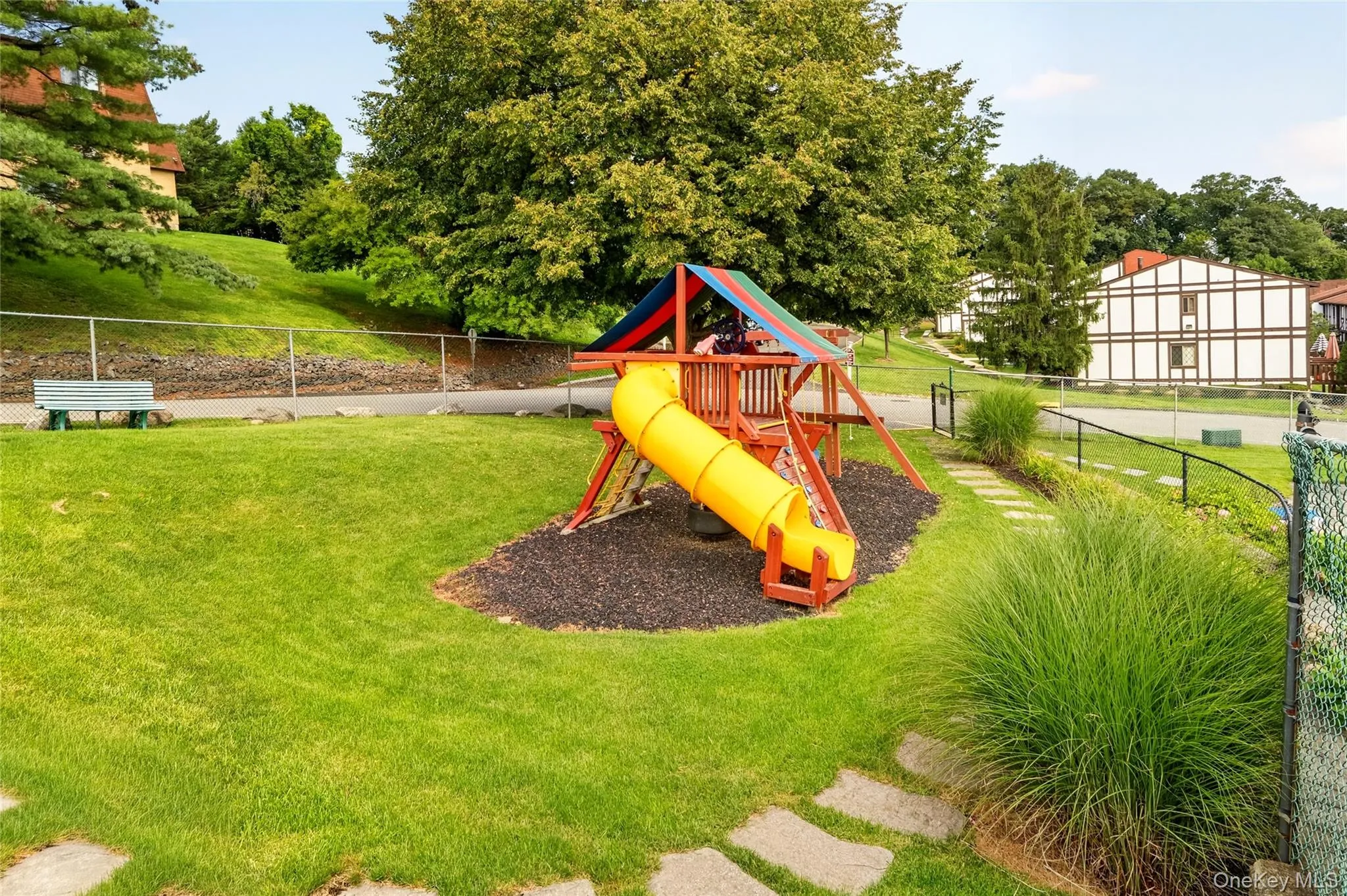 Community playground and open lawn area. Community playground and open lawn area.