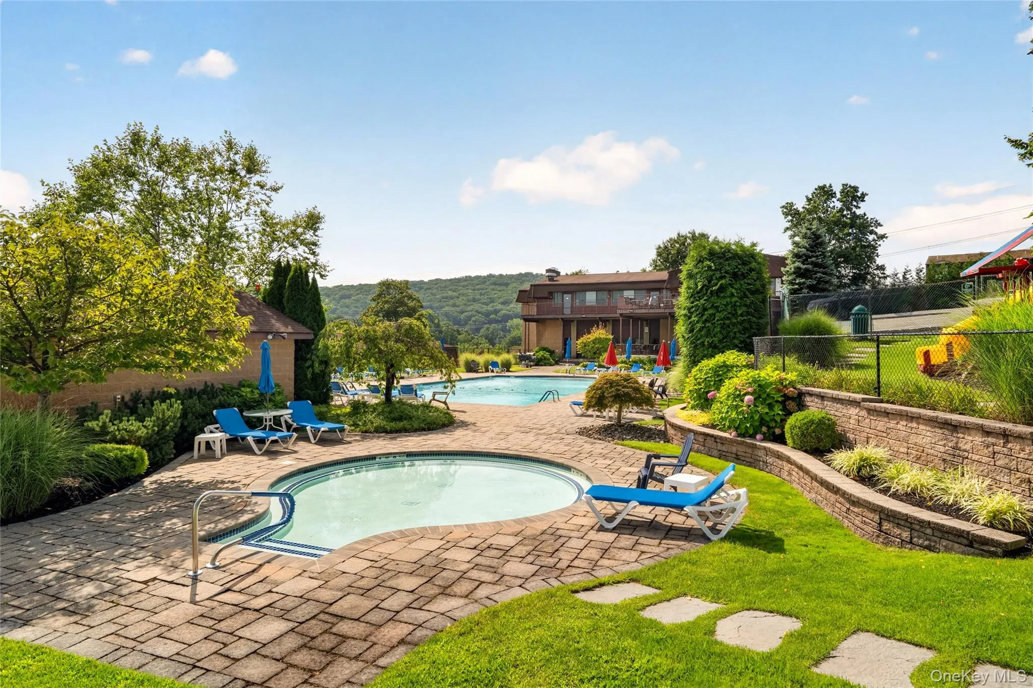 Landscaped pool area with an additional shallow pool. Landscaped pool area with an additional shallow pool.