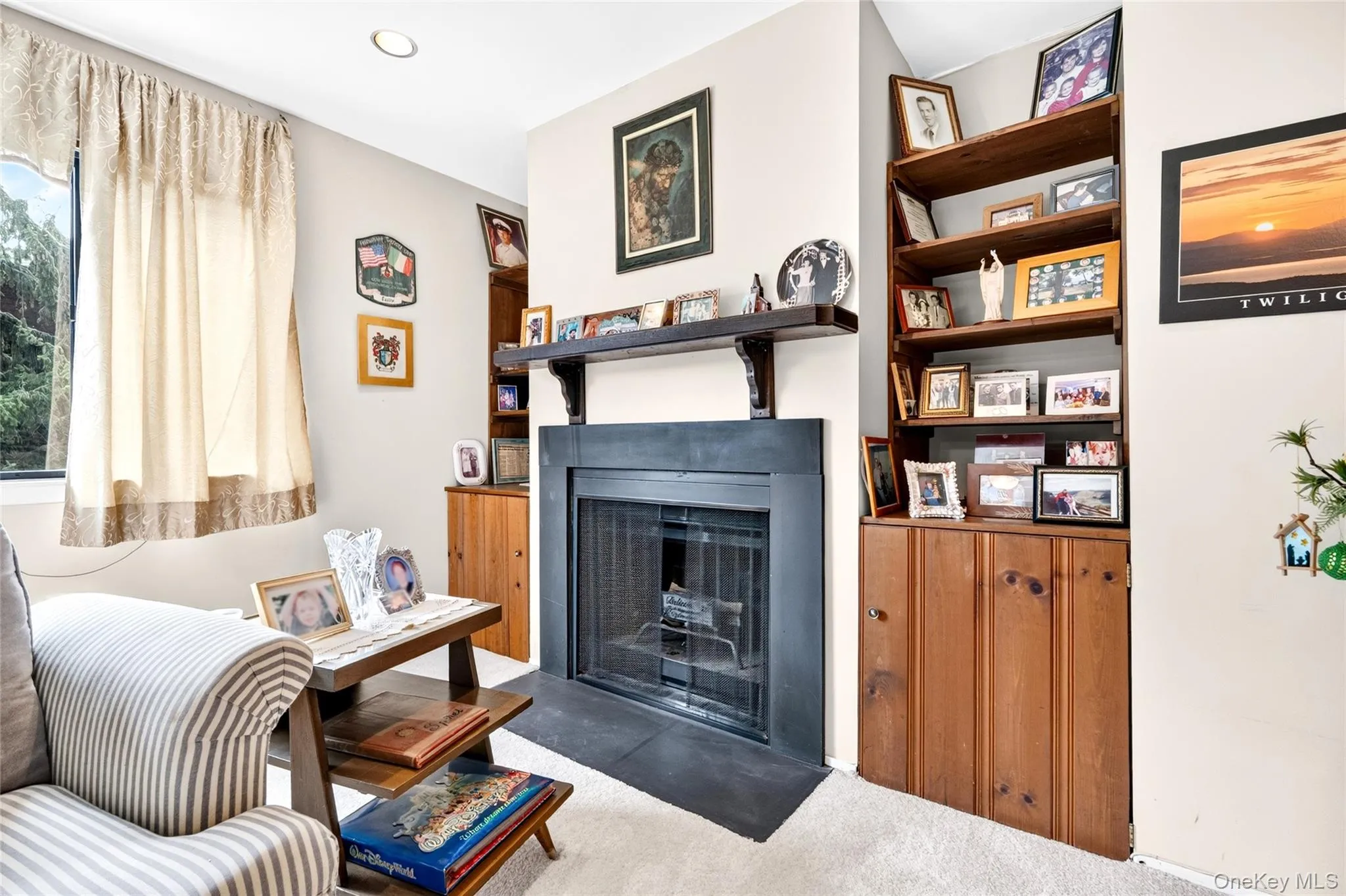 Fireplace with built-in shelving and storage. Fireplace with built-in shelving and storage.