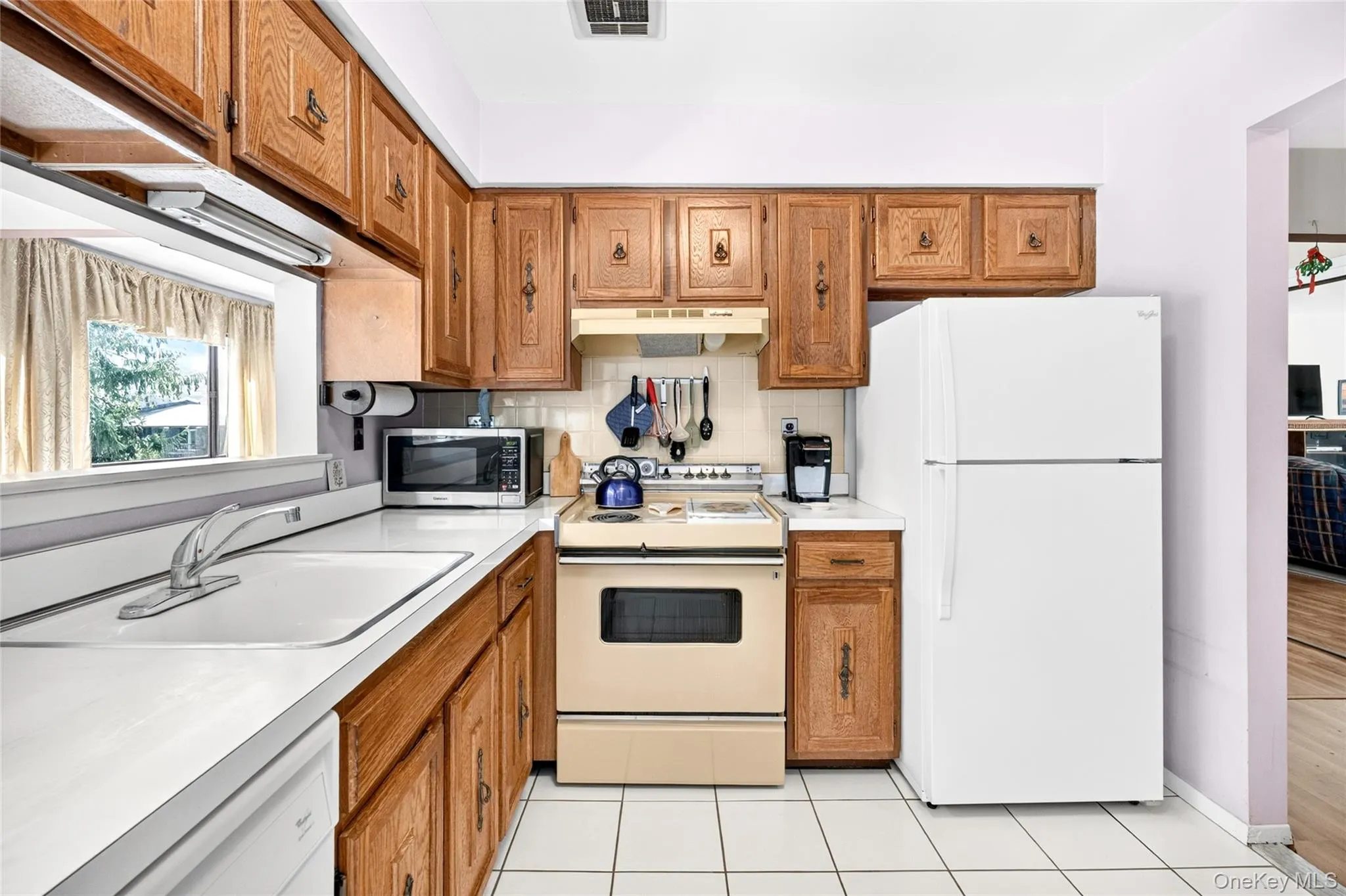 Kitchen with ample cabinetry and counter space. Kitchen with ample cabinetry and counter space.