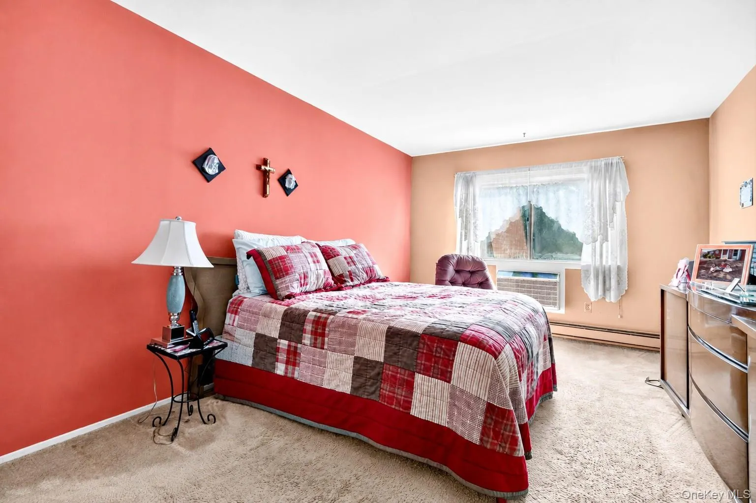Spacious bedroom with a large window. Spacious bedroom with a large window.