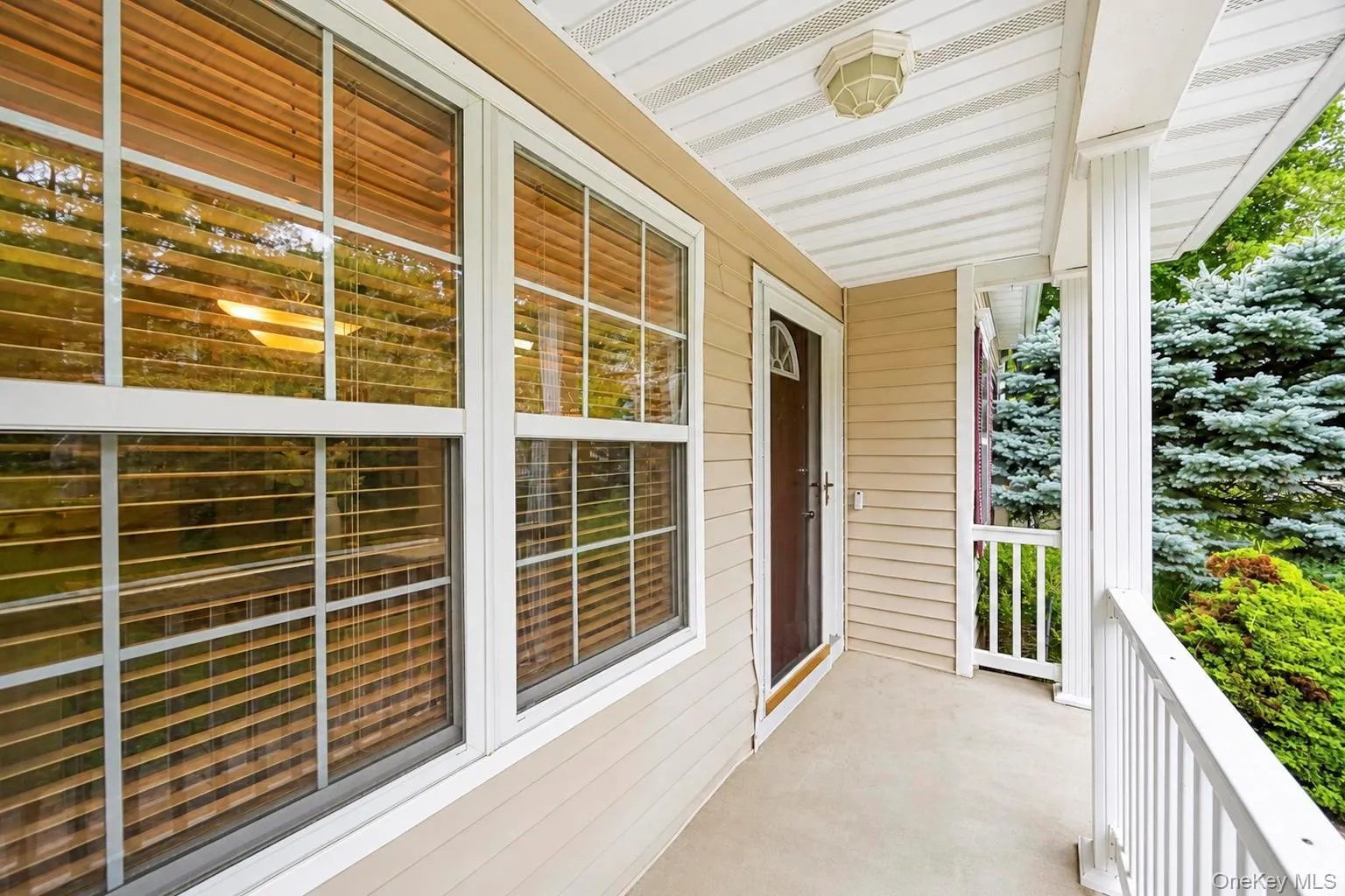 Front porch featuring covered sitting area Front porch featuring covered sitting area
