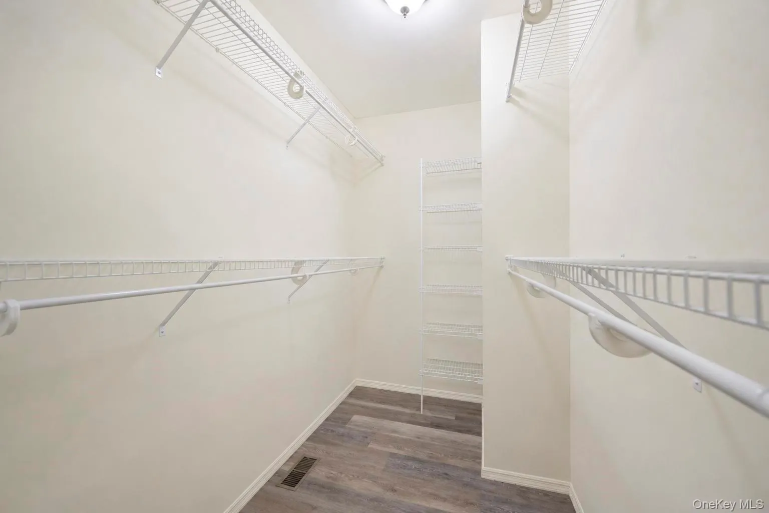Primary Bedroom walk-in closet Primary Bedroom walk-in closet