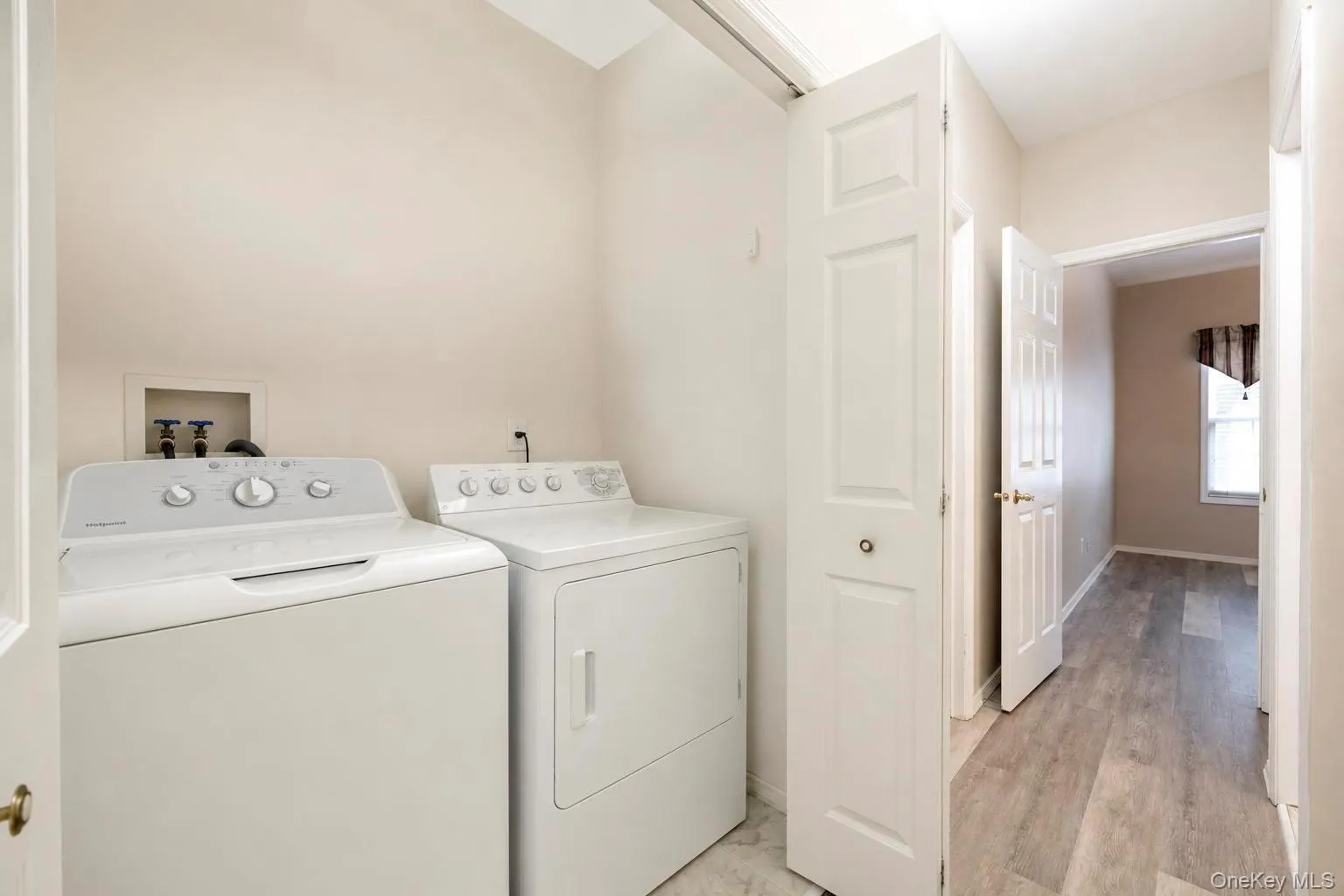 Dedicated laundry room located in hallway Dedicated laundry room located in hallway