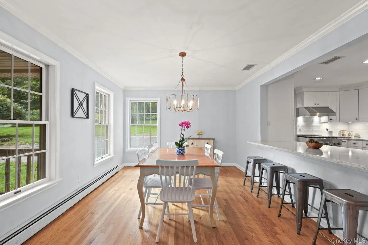 Open dining area and kitchen with breakfast bar Open dining area and kitchen with breakfast bar