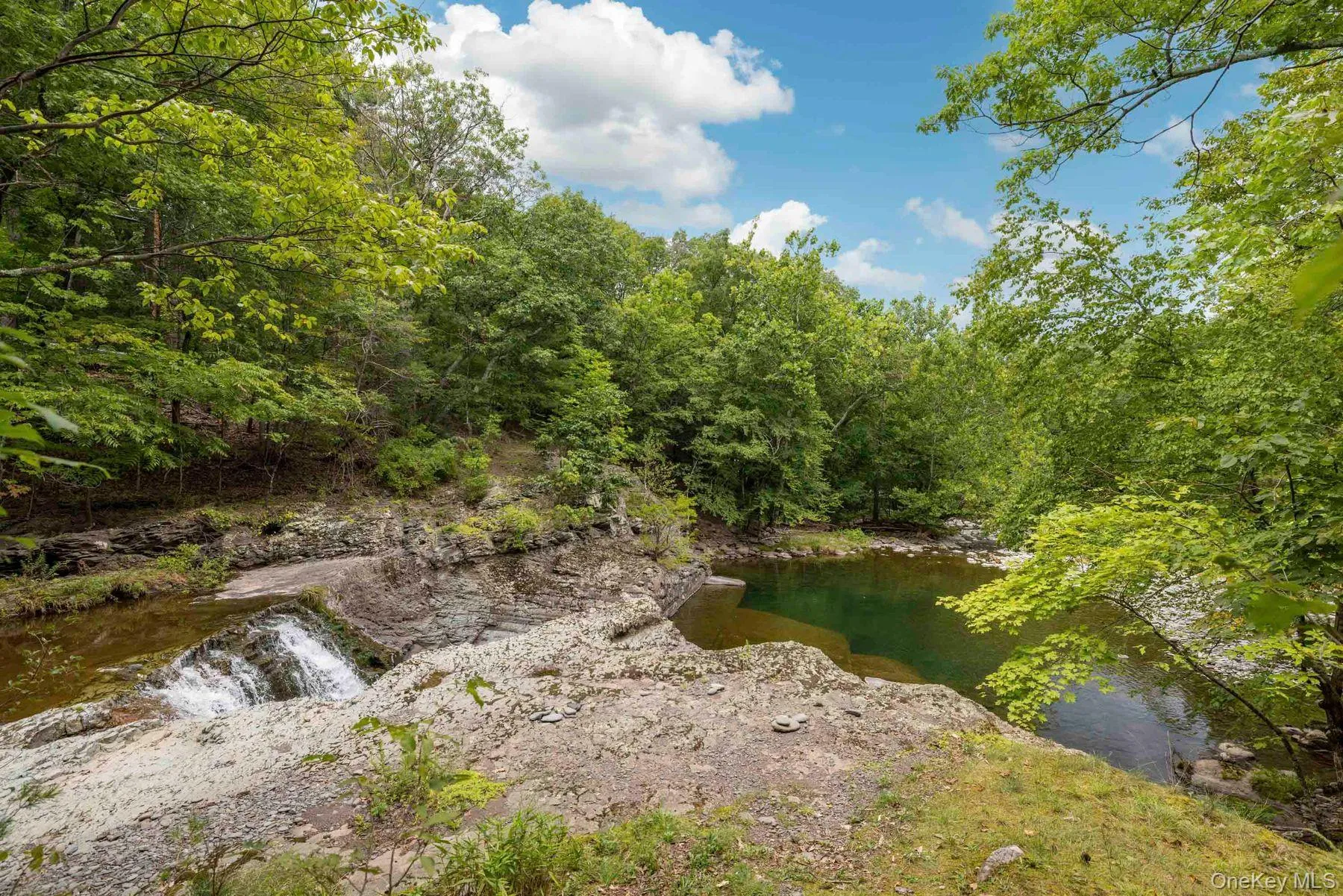 Private waterfall with natural rock ledge Private waterfall with natural rock ledge