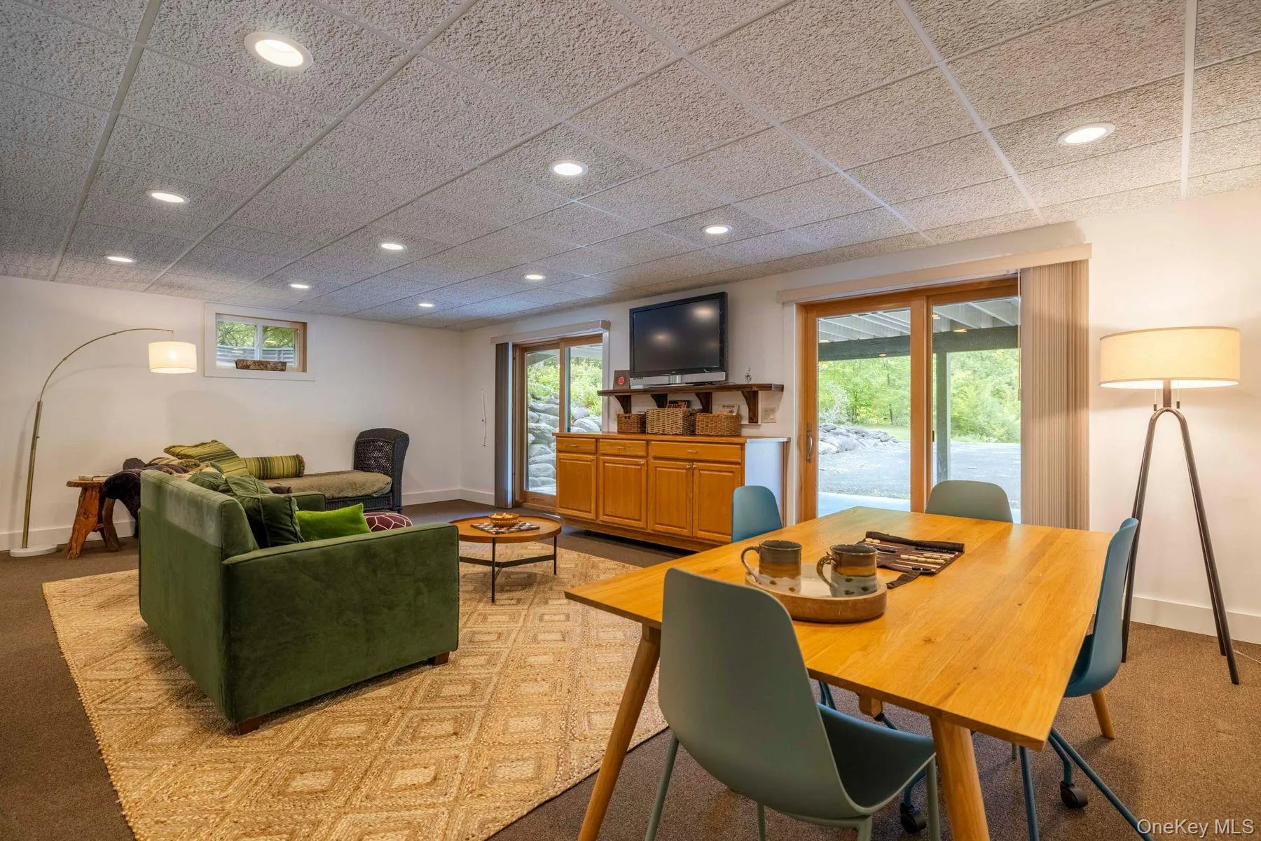Generous finished living space with double sliders opening directly to the outdoors Generous finished living space with double sliders opening directly to the outdoors