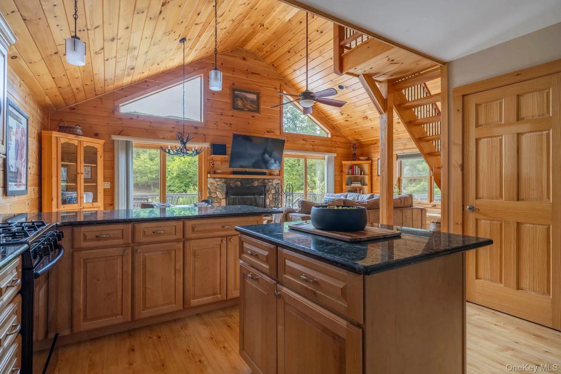 Open kitchen with center island providing additional prep space and storage Open kitchen with center island providing additional prep space and storage