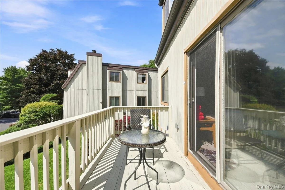 Private Balcony with wood railing and sliding glass door Private Balcony with wood railing and sliding glass door