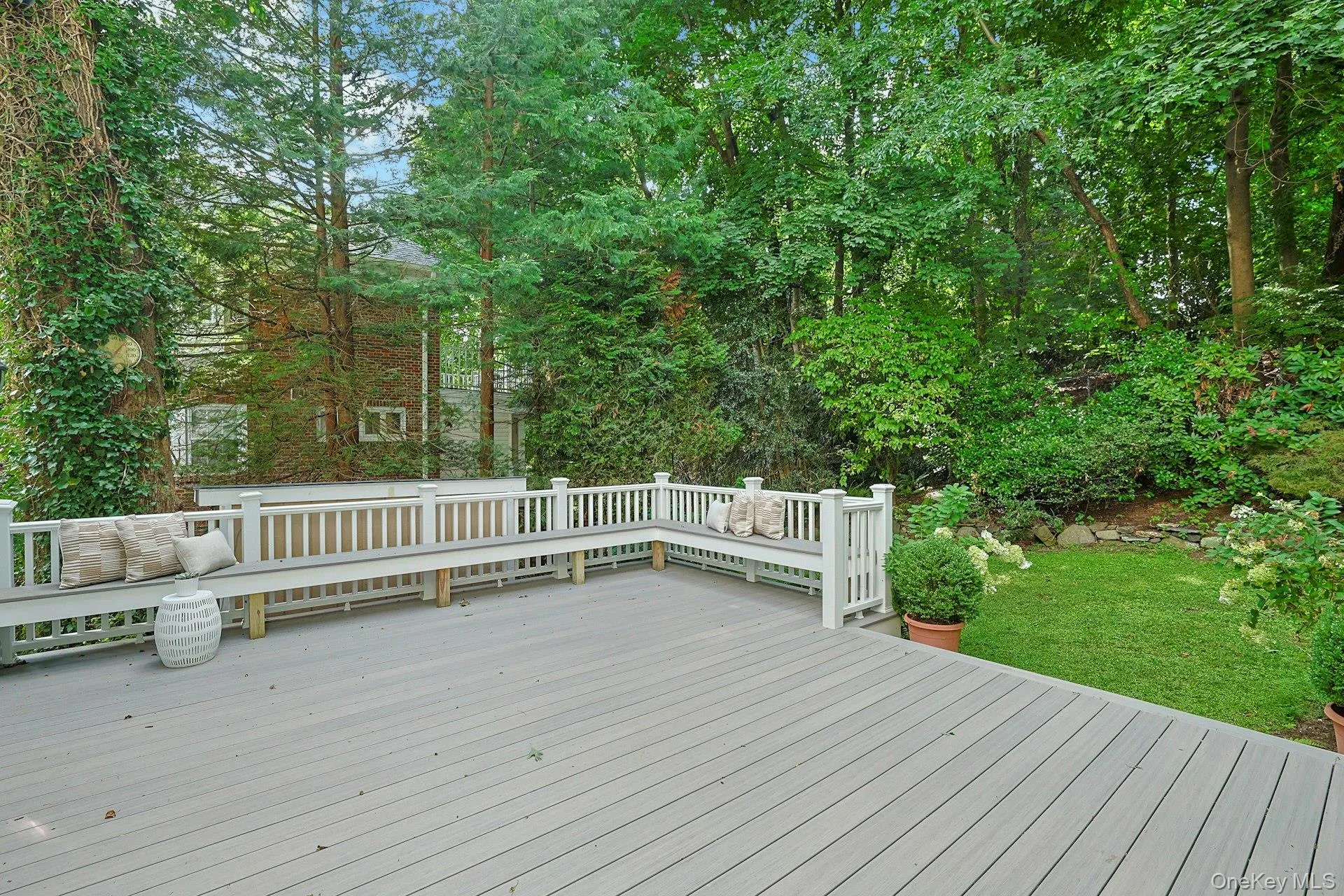 An exceptionally generous deck provides ample room for outdoor dining, grilling and lounging while overlooking the peaceful backyard. An exceptionally generous deck provides ample room for outdoor dining, grilling and lounging while overlooking the peaceful backyard.