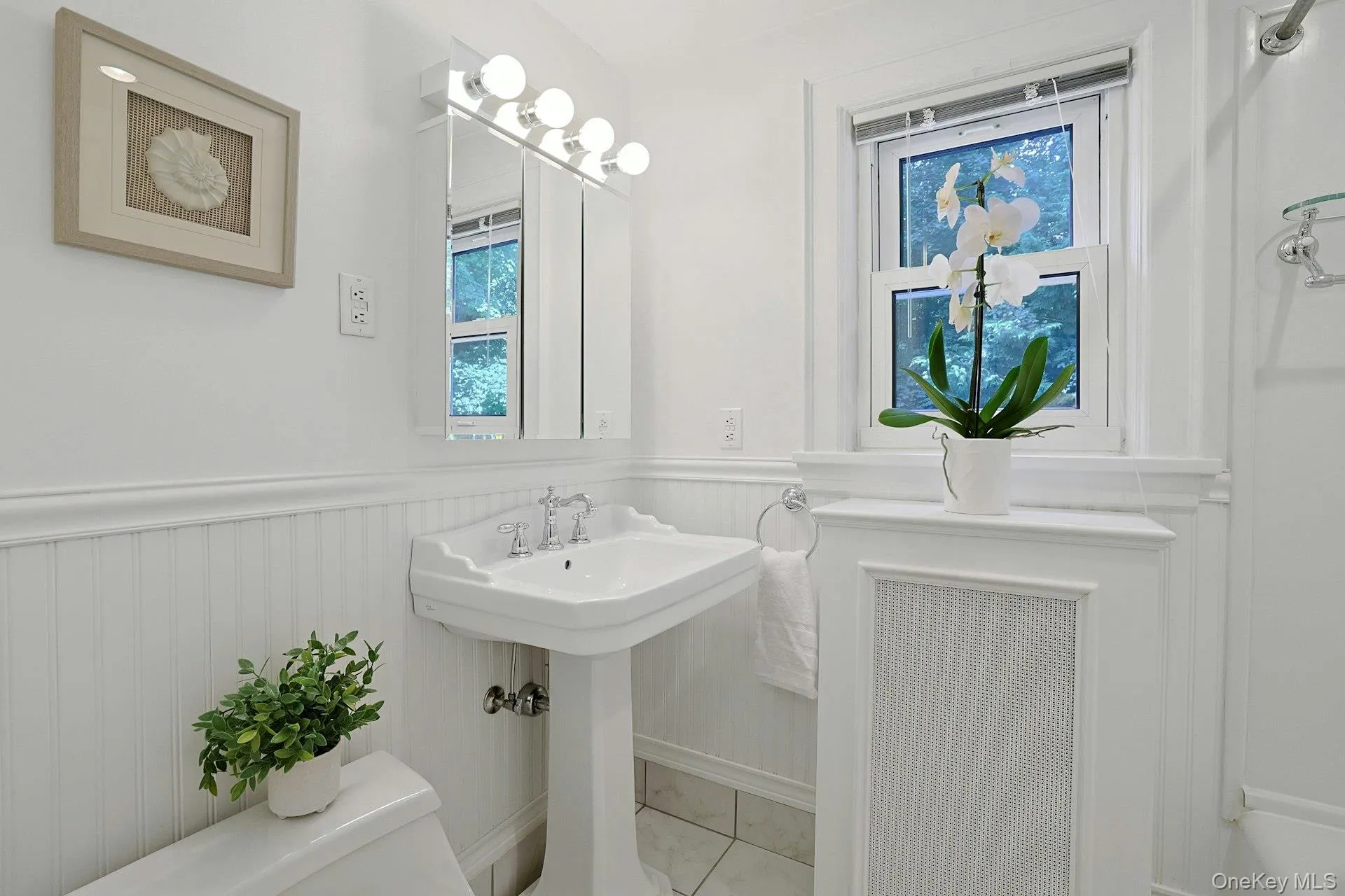 A crisp, bright hall bath serves the two third-floor bedrooms and completes this wonderfully functional level. A crisp, bright hall bath serves the two third-floor bedrooms and completes this wonderfully functional level.