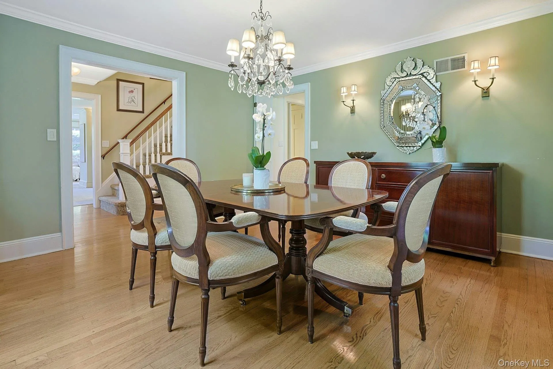 This additional view of the dining room showcases its gracious proportions, hardwood floors and convenient connection to the foyer and kitchen. This additional view of the dining room showcases its gracious proportions, hardwood floors and convenient connection to the foyer and kitchen.