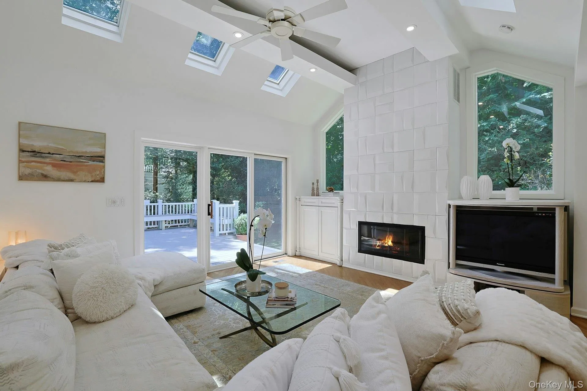 The expansive family room offers plenty of room to relax and entertain, complemented by built-ins, a gas fireplace and views of the surrounding greenery. The expansive family room offers plenty of room to relax and entertain, complemented by built-ins, a gas fireplace and views of the surrounding greenery.