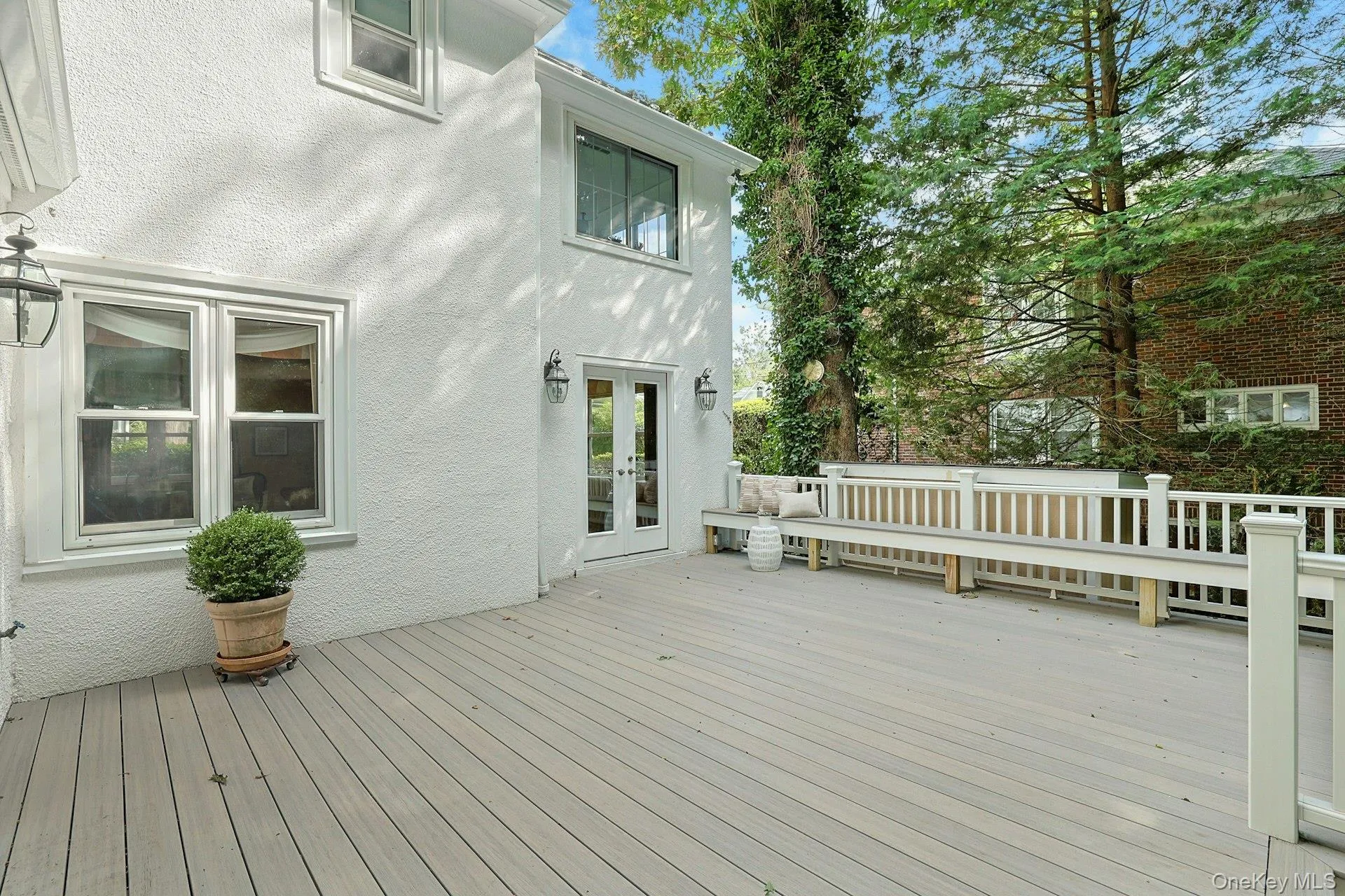 Direct access from the family room and sunroom creates an effortless flow to the deck and makes outdoor entertaining a natural extension of the home. Direct access from the family room and sunroom creates an effortless flow to the deck and makes outdoor entertaining a natural extension of the home.