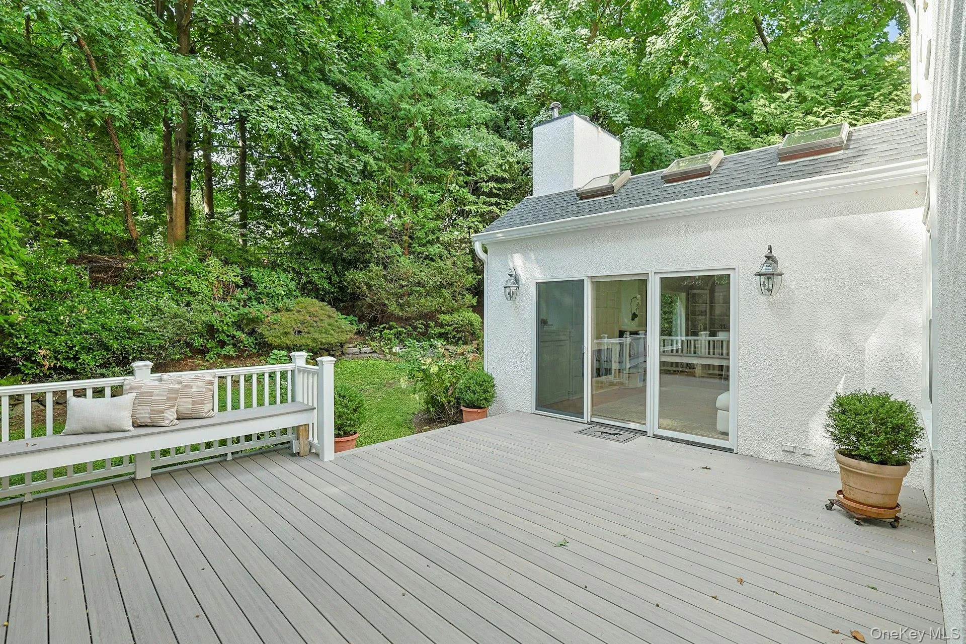 The oversized deck provides abundant space for outdoor dining, grilling and lounging, all surrounded by the peaceful greenery of the backyard. The oversized deck provides abundant space for outdoor dining, grilling and lounging, all surrounded by the peaceful greenery of the backyard.