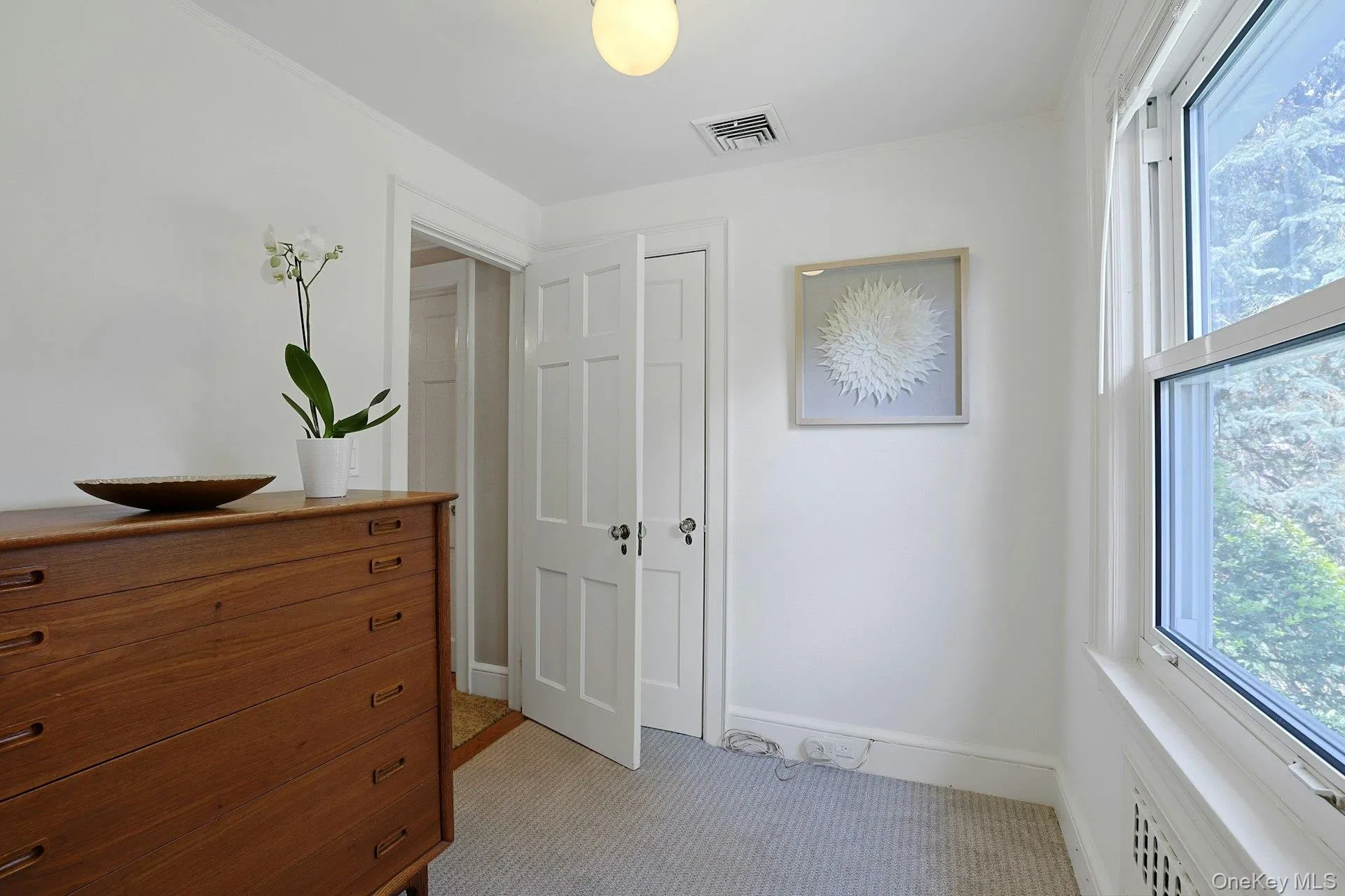 A separate room within the primary suite offers valuable flexibility as a private office, dressing room or additional walk-in closet. It also opens to the main hallway. A separate room within the primary suite offers valuable flexibility as a private office, dressing room or additional walk-in closet. It also opens to the main hallway.
