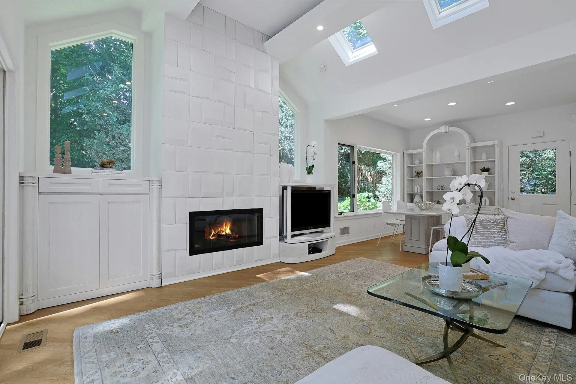 A dramatic vaulted ceiling, skylights and oversized windows give the family room an exceptional sense of openness and light. A dramatic vaulted ceiling, skylights and oversized windows give the family room an exceptional sense of openness and light.