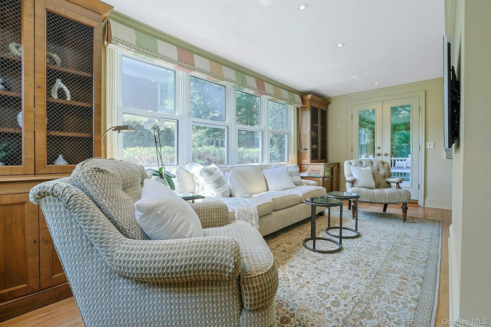 Surrounded by windows and enhanced by built-in cabinetry, this cheerful sunroom is a wonderful spot for reading, relaxing or watching a favorite show. Surrounded by windows and enhanced by built-in cabinetry, this cheerful sunroom is a wonderful spot for reading, relaxing or watching a favorite show.