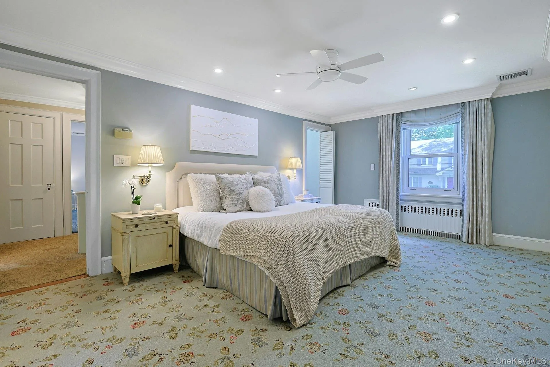 The generously sized primary bedroom is a peaceful retreat with multiple exposures, recessed lighting and excellent closet space. The generously sized primary bedroom is a peaceful retreat with multiple exposures, recessed lighting and excellent closet space.