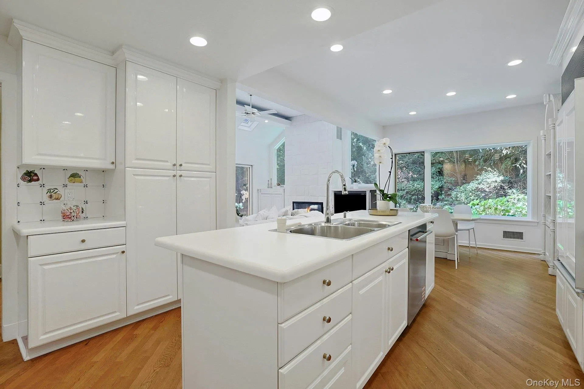 Abundant cabinetry and counter space combine with the generous island to create a highly functional kitchen that flows directly into the adjoining living spaces. Abundant cabinetry and counter space combine with the generous island to create a highly functional kitchen that flows directly into the adjoining living spaces.