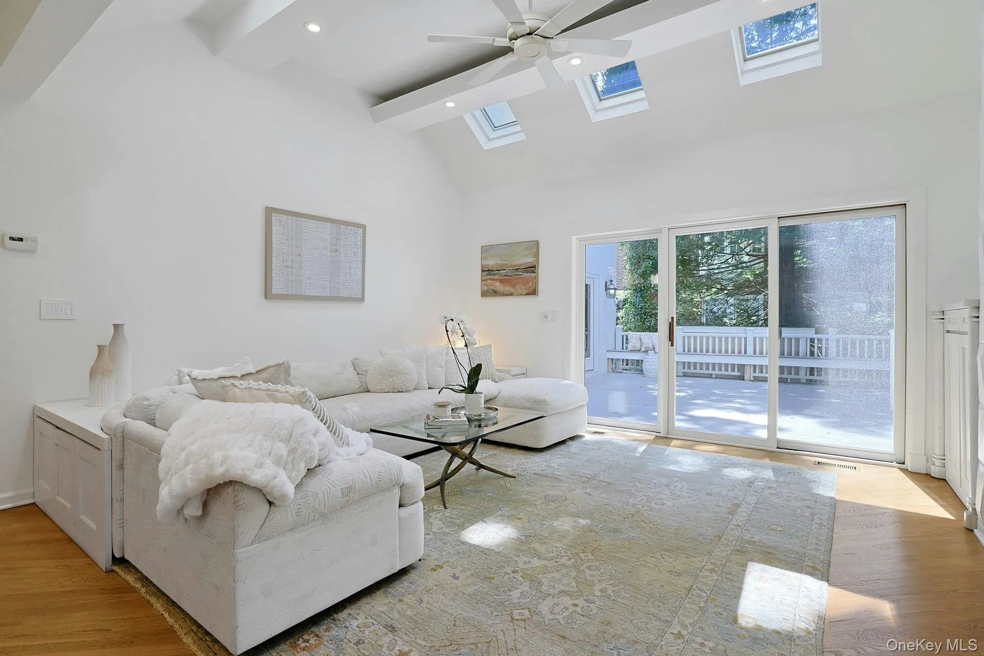 Large sliding glass doors connect the family room directly to the deck, making outdoor dining and entertaining effortless. Large sliding glass doors connect the family room directly to the deck, making outdoor dining and entertaining effortless.