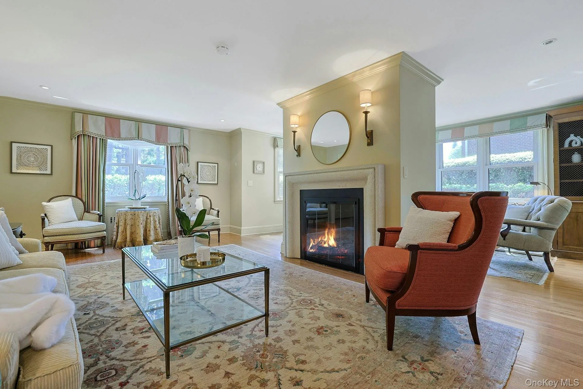 Bright and beautifully proportioned, the formal living room is centered around a handsome gas fireplace. Bright and beautifully proportioned, the formal living room is centered around a handsome gas fireplace.