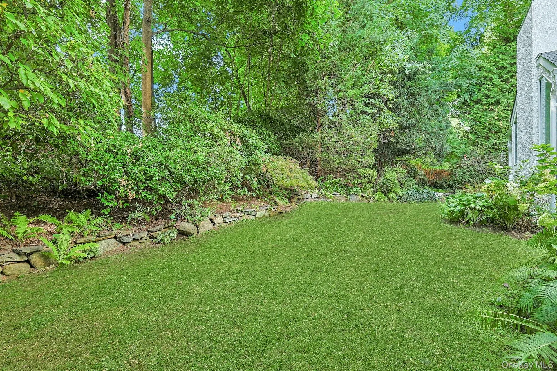Surrounded by mature trees and lush landscaping, the mostly level, fully fenced backyard offers a wonderfully private setting for play and relaxation. Surrounded by mature trees and lush landscaping, the mostly level, fully fenced backyard offers a wonderfully private setting for play and relaxation.