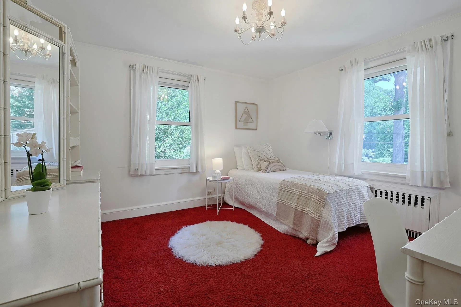 Another lovely second-floor bedroom is filled with natural light from multiple windows and offers excellent proportions. Another lovely second-floor bedroom is filled with natural light from multiple windows and offers excellent proportions.