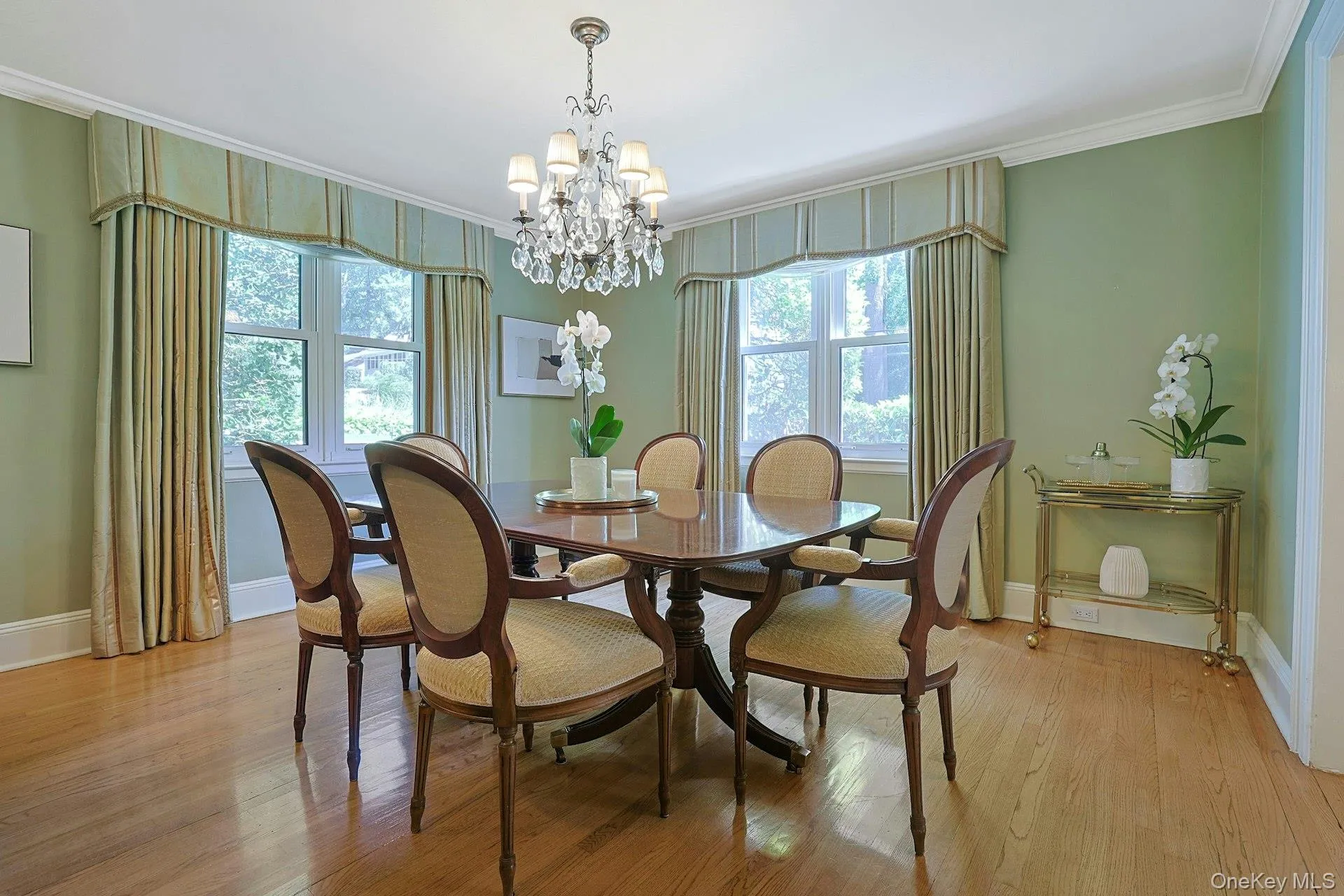An elegant, light-filled dining room provides a beautiful setting for holiday dinners, celebrations and memorable gatherings. An elegant, light-filled dining room provides a beautiful setting for holiday dinners, celebrations and memorable gatherings.