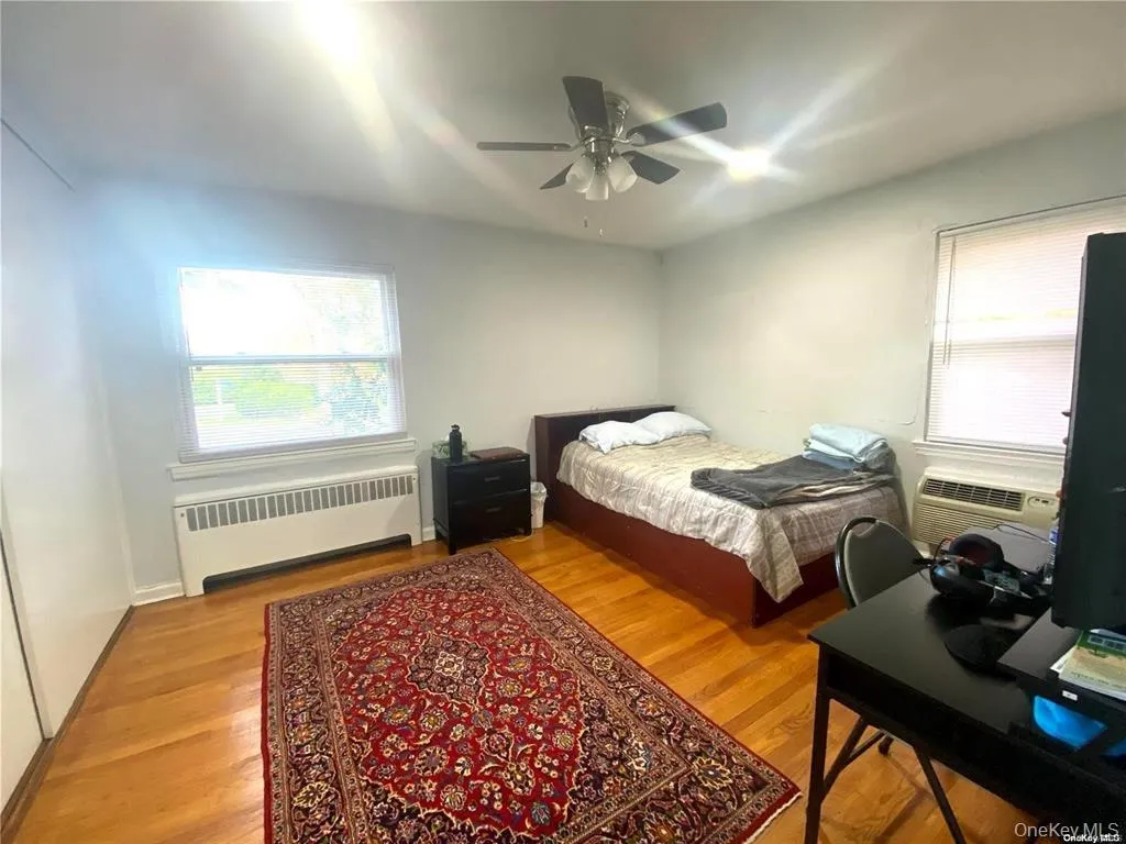 Hardwood flooring, two windows, ceiling fan, and baseboard Gas heating unit. Hardwood flooring, two windows, ceiling fan, and baseboard Gas heating unit.