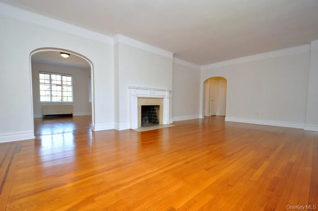 Large Living Room, casement windows, hardwood floors and arched doorways. The living Room is 23'-11" x 14'-9". Large Living Room, casement windows, hardwood floors and arched doorways. The living Room is 23'-11" x 14'-9".