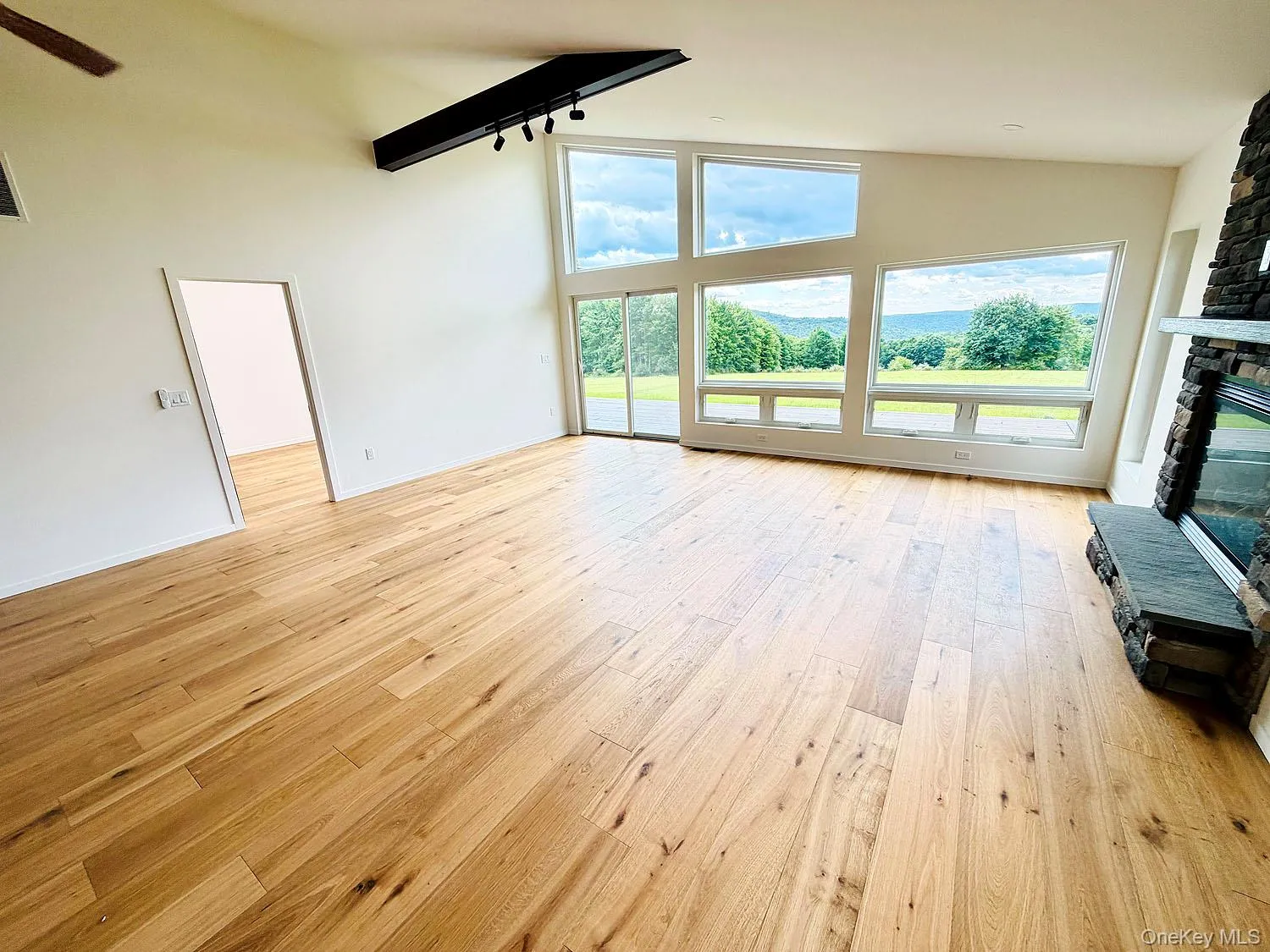 Washed with light from floor-to-ceiling windows. Sliding door to spacious deck. Gorgeous wood floors! Washed with light from floor-to-ceiling windows. Sliding door to spacious deck. Gorgeous wood floors!