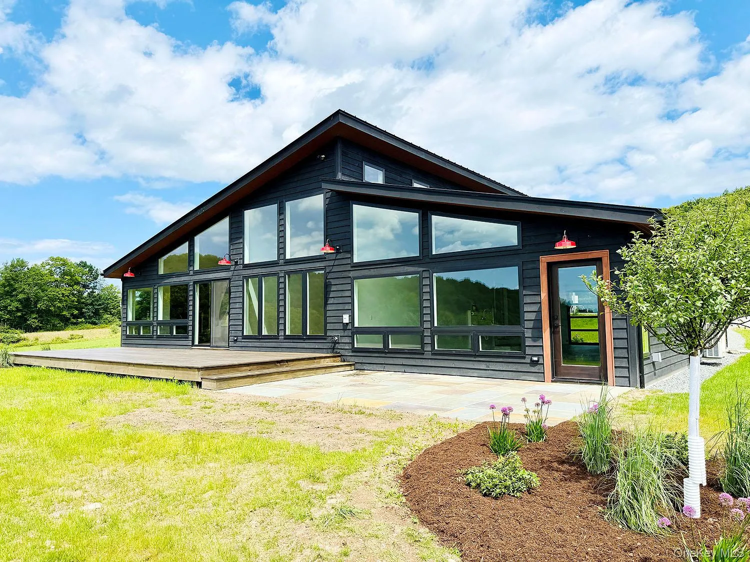 The back of the home is nearly all glass to max the views... Even the garage/studio The back of the home is nearly all glass to max the views... Even the garage/studio