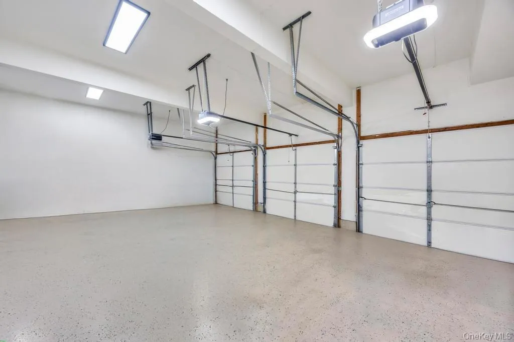 Garage featuring a garage door opener Garage featuring a garage door opener