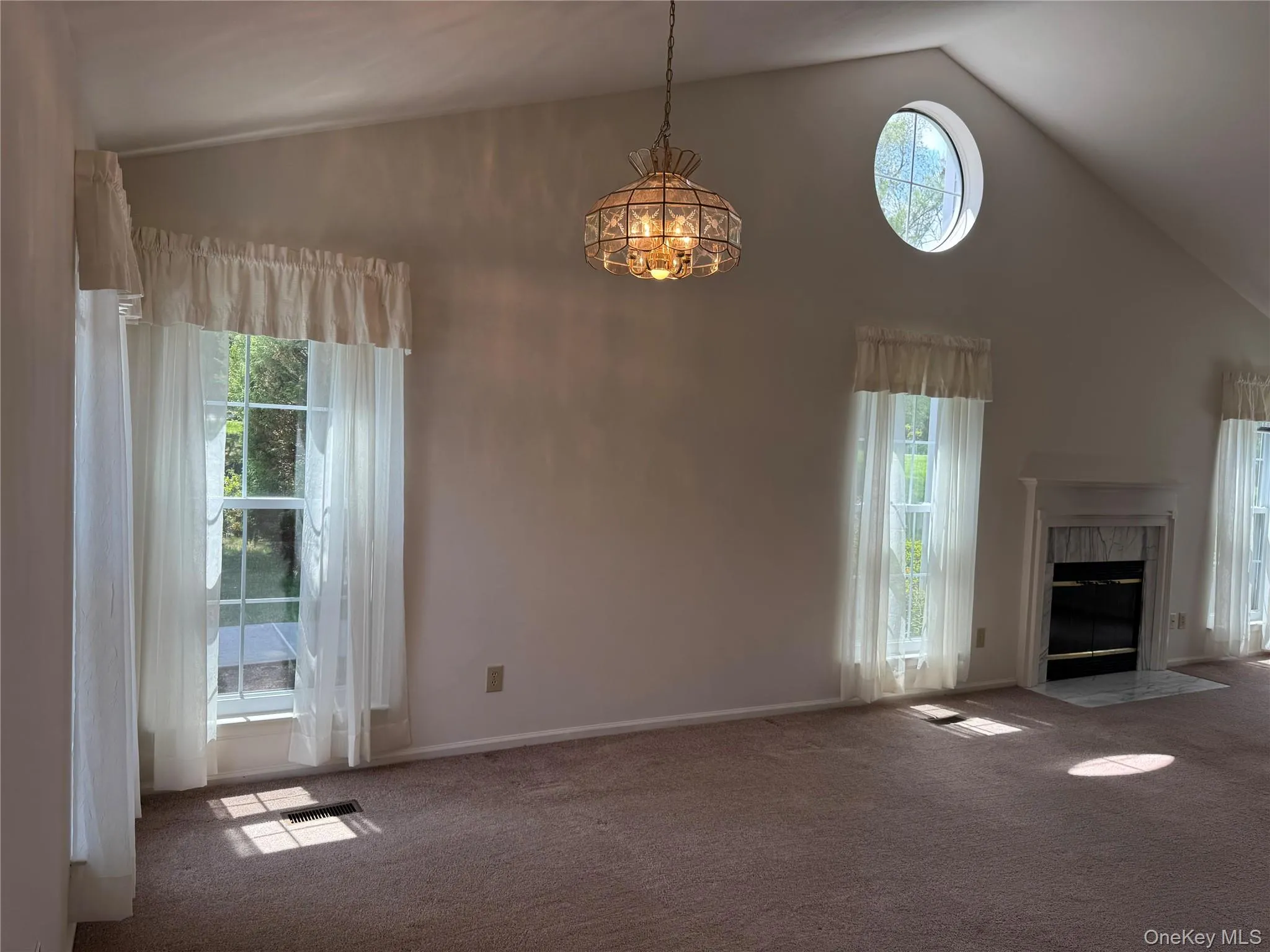 Living room / Dining room with Cathedral ceiling and fireplace. Living room / Dining room with Cathedral ceiling and fireplace.