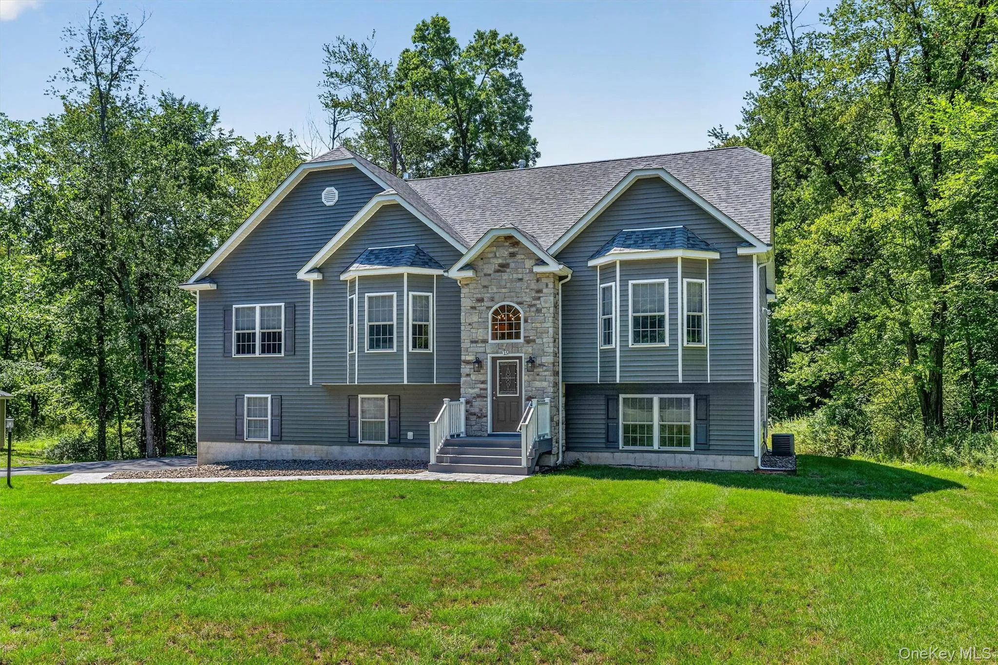 Contemporary exterior with mixed siding and stone accents Contemporary exterior with mixed siding and stone accents