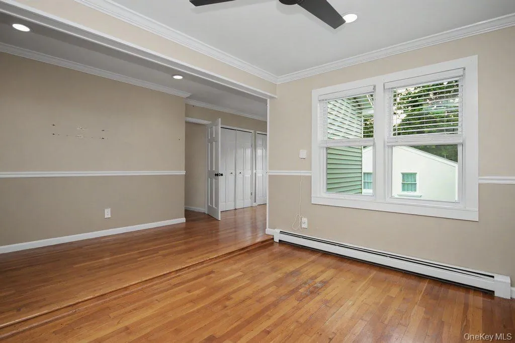 Primary bedroom offers wood floors and recessed lighting Primary bedroom offers wood floors and recessed lighting