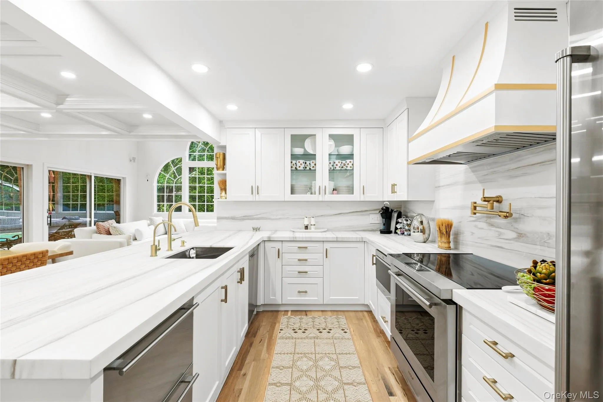 Chef's kitchen with marble counter tops,Wolf induction range, pot water filler, Wolf undercounter microwave, Bosh dishwasher, Sub-Zero refrigerator with two additional undercounter drawers, food pantry Chef's kitchen with marble counter tops,Wolf induction range, pot water filler, Wolf undercounter microwave, Bosh dishwasher, Sub-Zero refrigerator with two additional undercounter drawers, food pantry