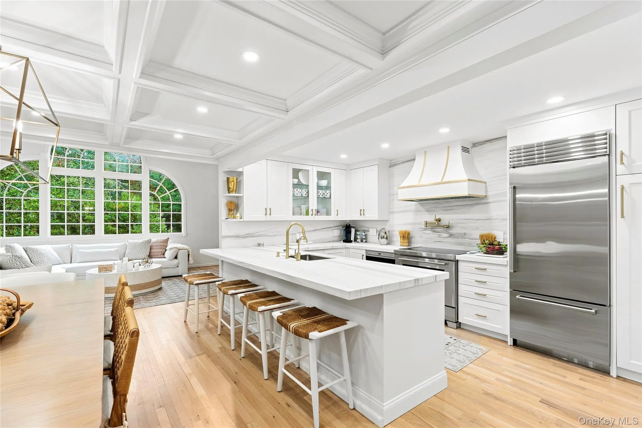 Open and bright with mable countertops and backsplashes along with recessed lighting and hardwood floors Open and bright with mable countertops and backsplashes along with recessed lighting and hardwood floors