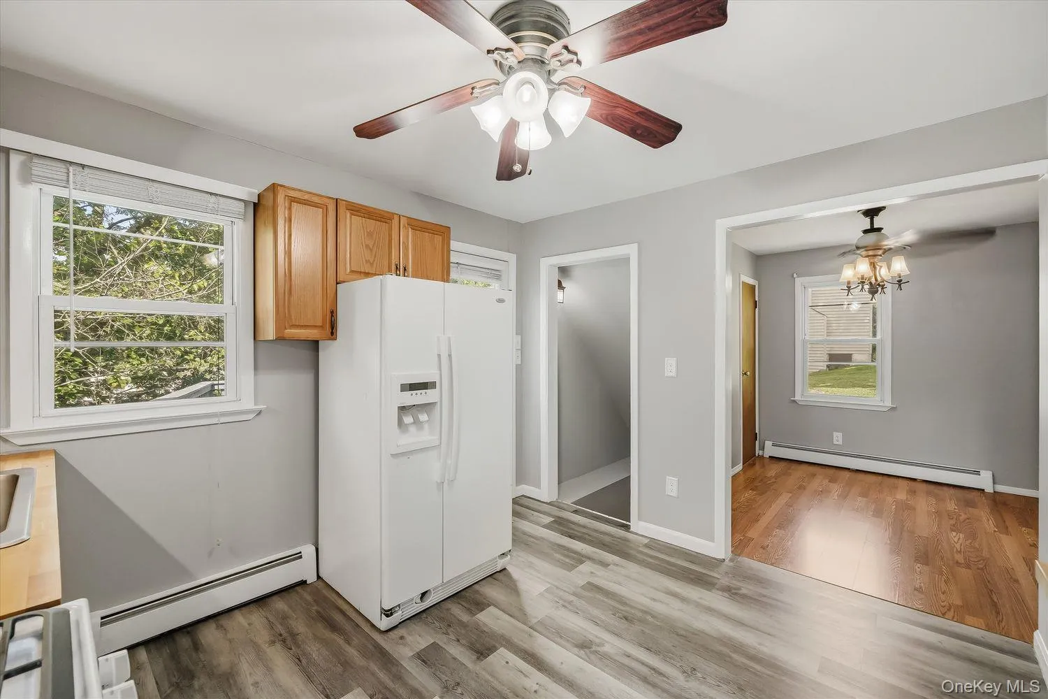 Kitchen with view of dining room and lower-level access Kitchen with view of dining room and lower-level access