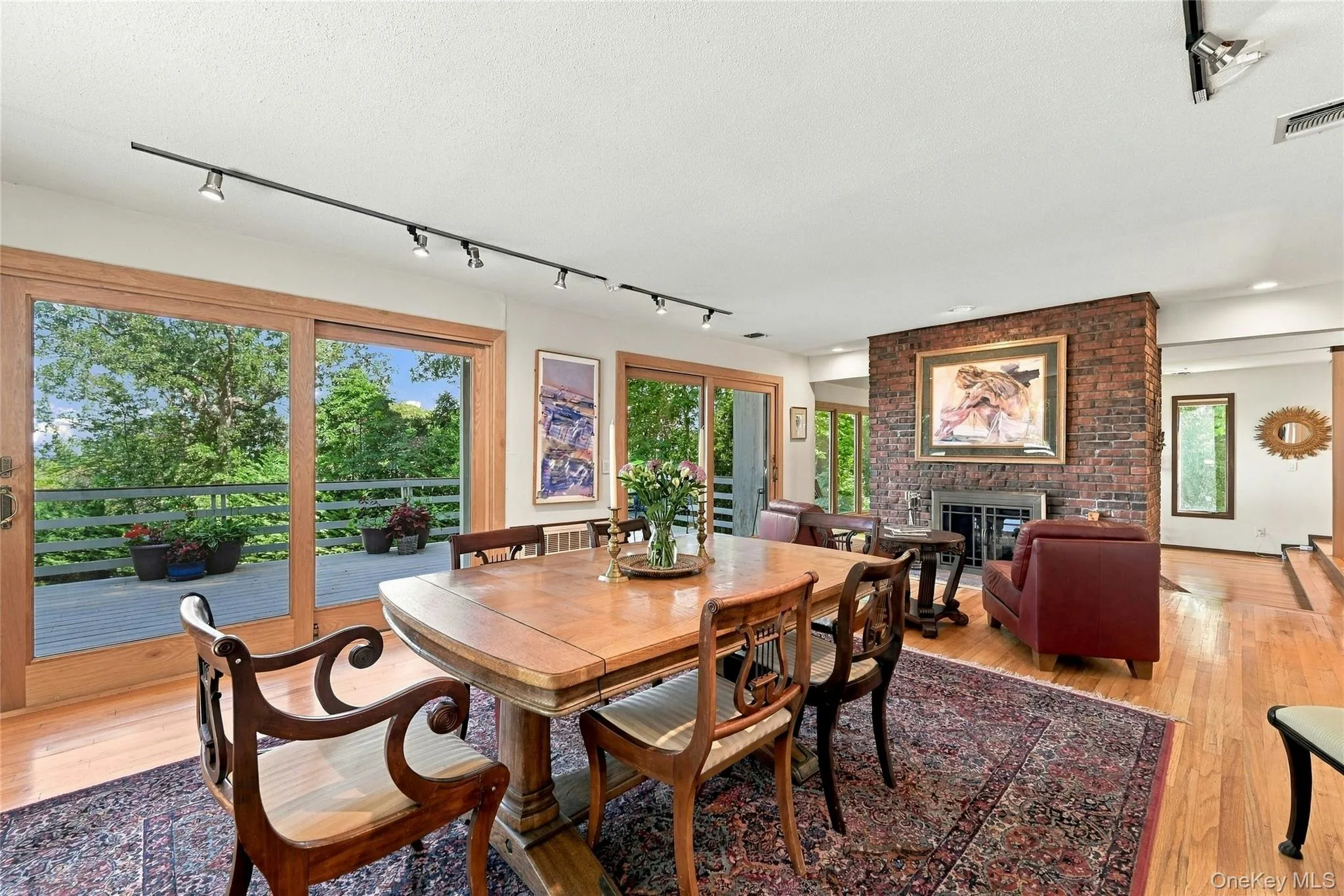 Formal Dining with Double Sided Fireplace and Balcony with Water Views Formal Dining with Double Sided Fireplace and Balcony with Water Views