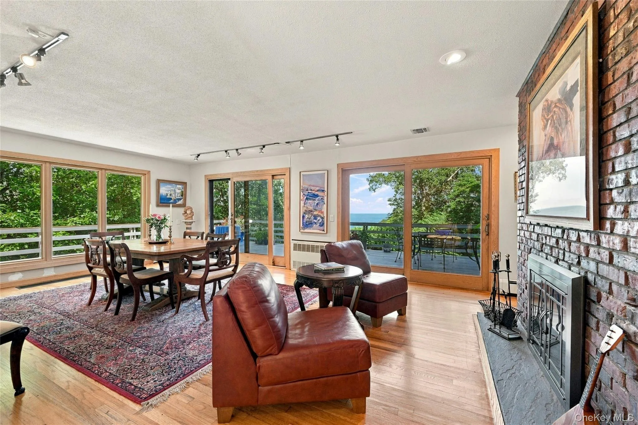 Formal Dining with Double Sided Fireplace and Water Views Formal Dining with Double Sided Fireplace and Water Views