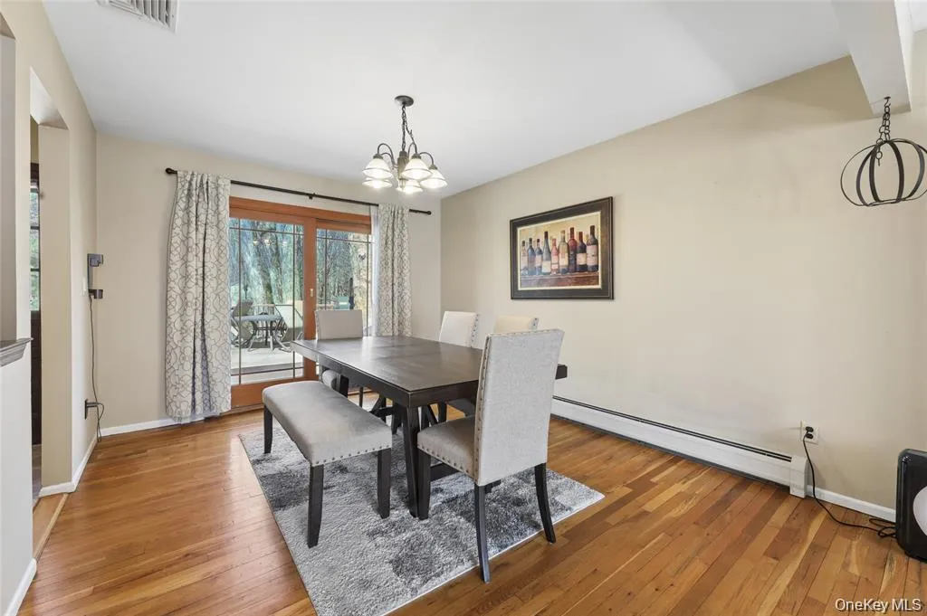 Spacious dining area with doors leading to oversized trex deck Spacious dining area with doors leading to oversized trex deck