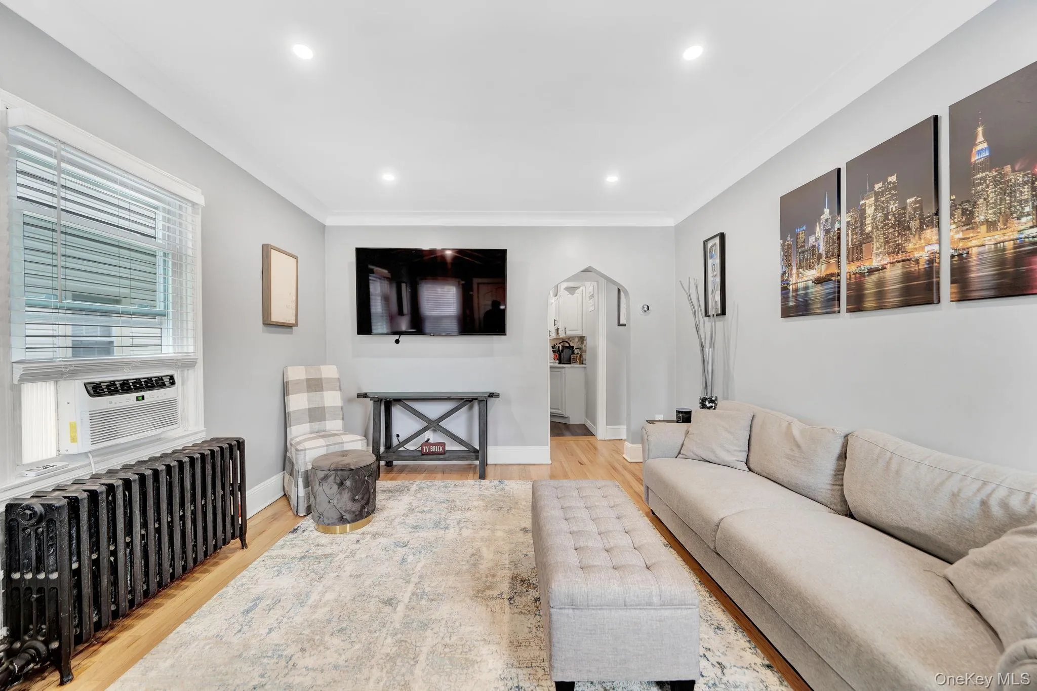 Living room with recessed lighting and hard wood floors Living room with recessed lighting and hard wood floors