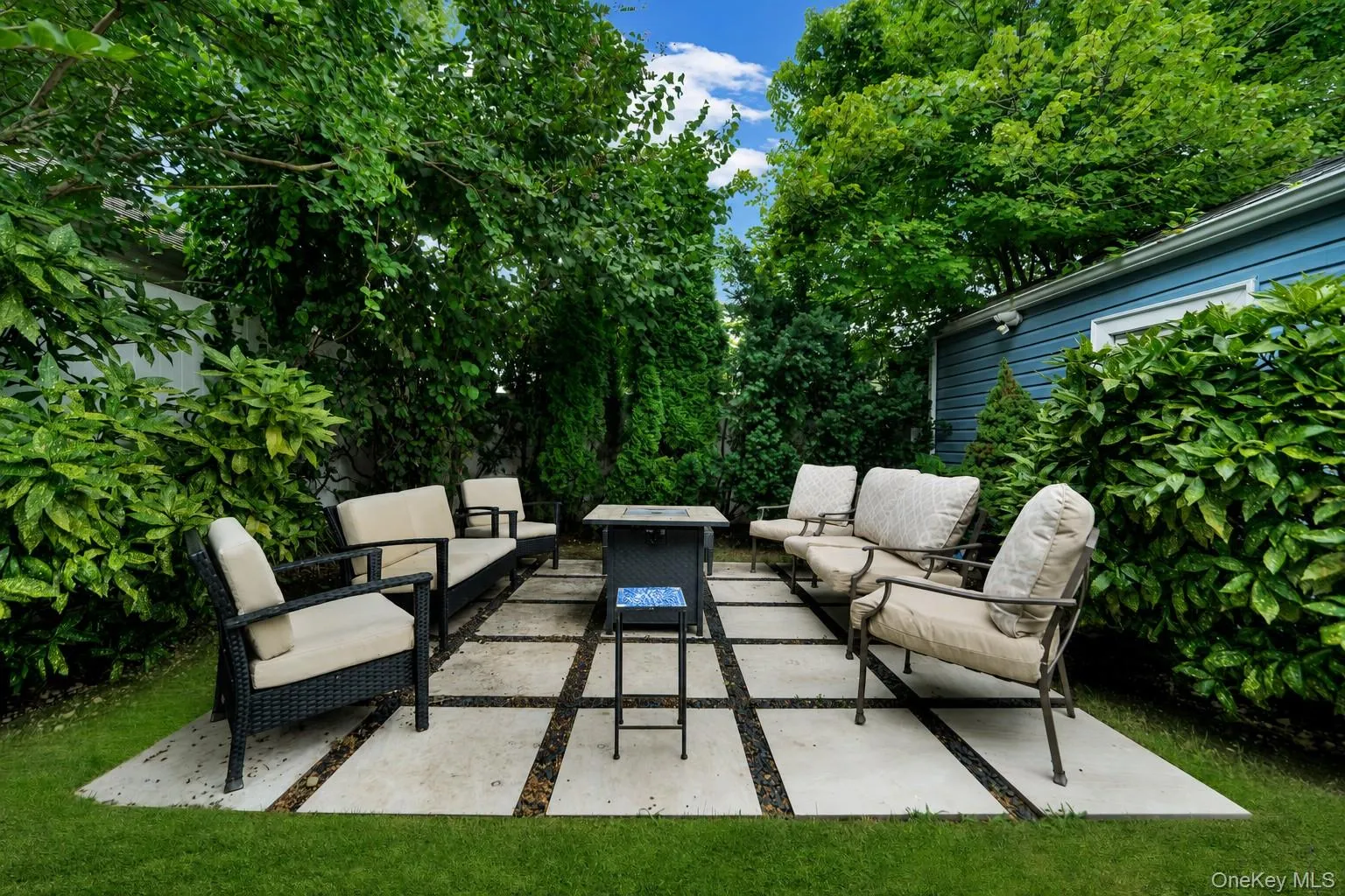 Patio in backyard next to garage Patio in backyard next to garage