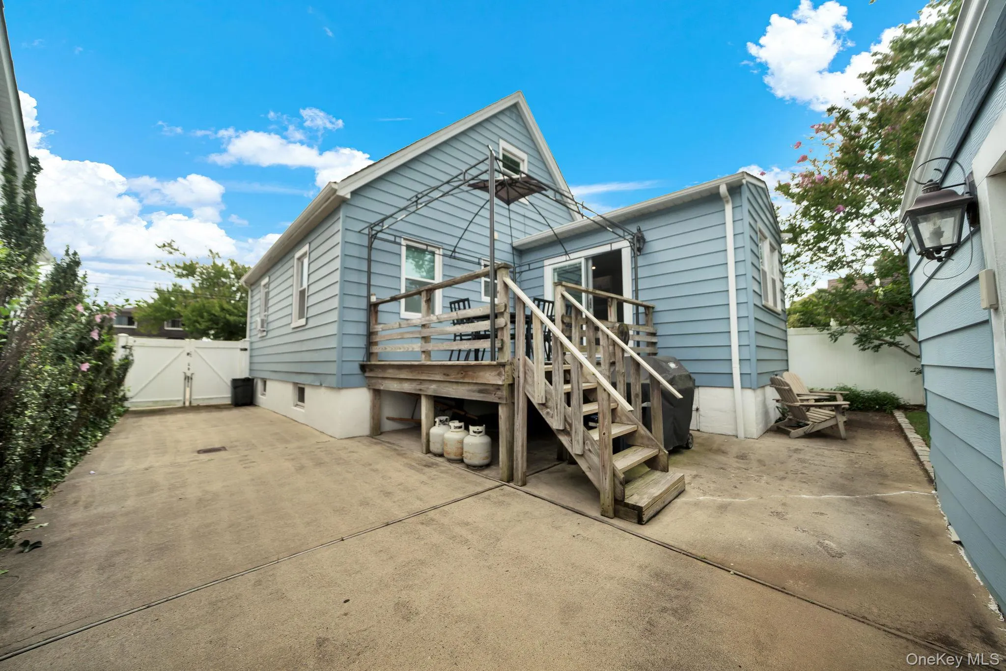 Driveway, rear of house and deck Driveway, rear of house and deck